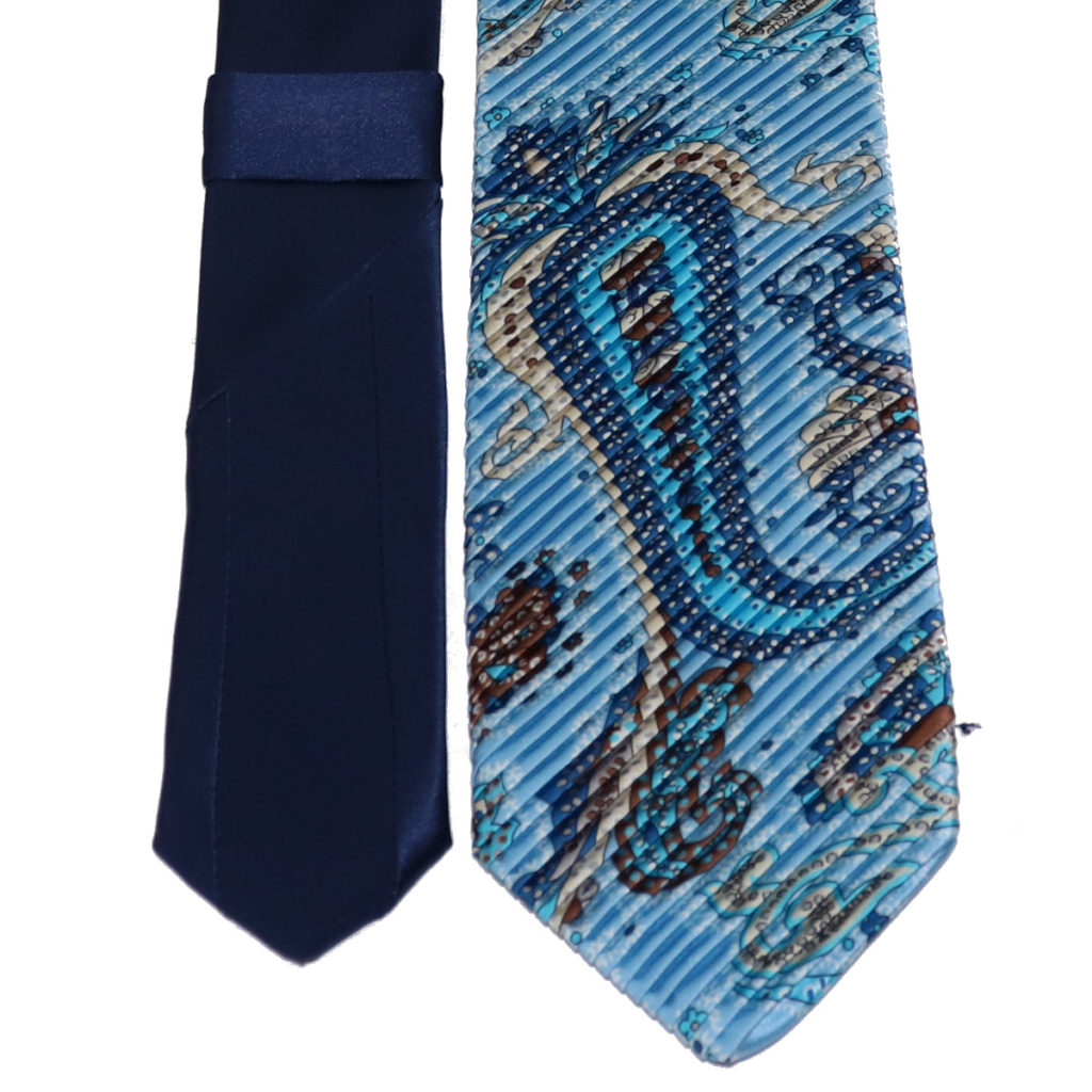 Light blue pleated silk tie, paisley pattern, contrasting knot