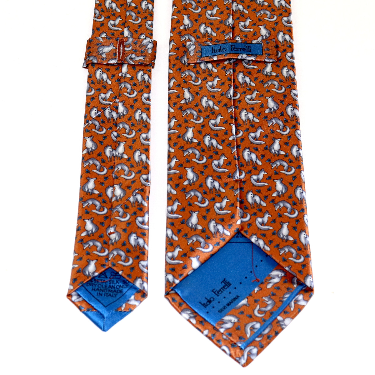 Animal print tie, rust background and all over gray fox pattern, gìhandmade  in Italy - Italo Ferretti Luxury Store